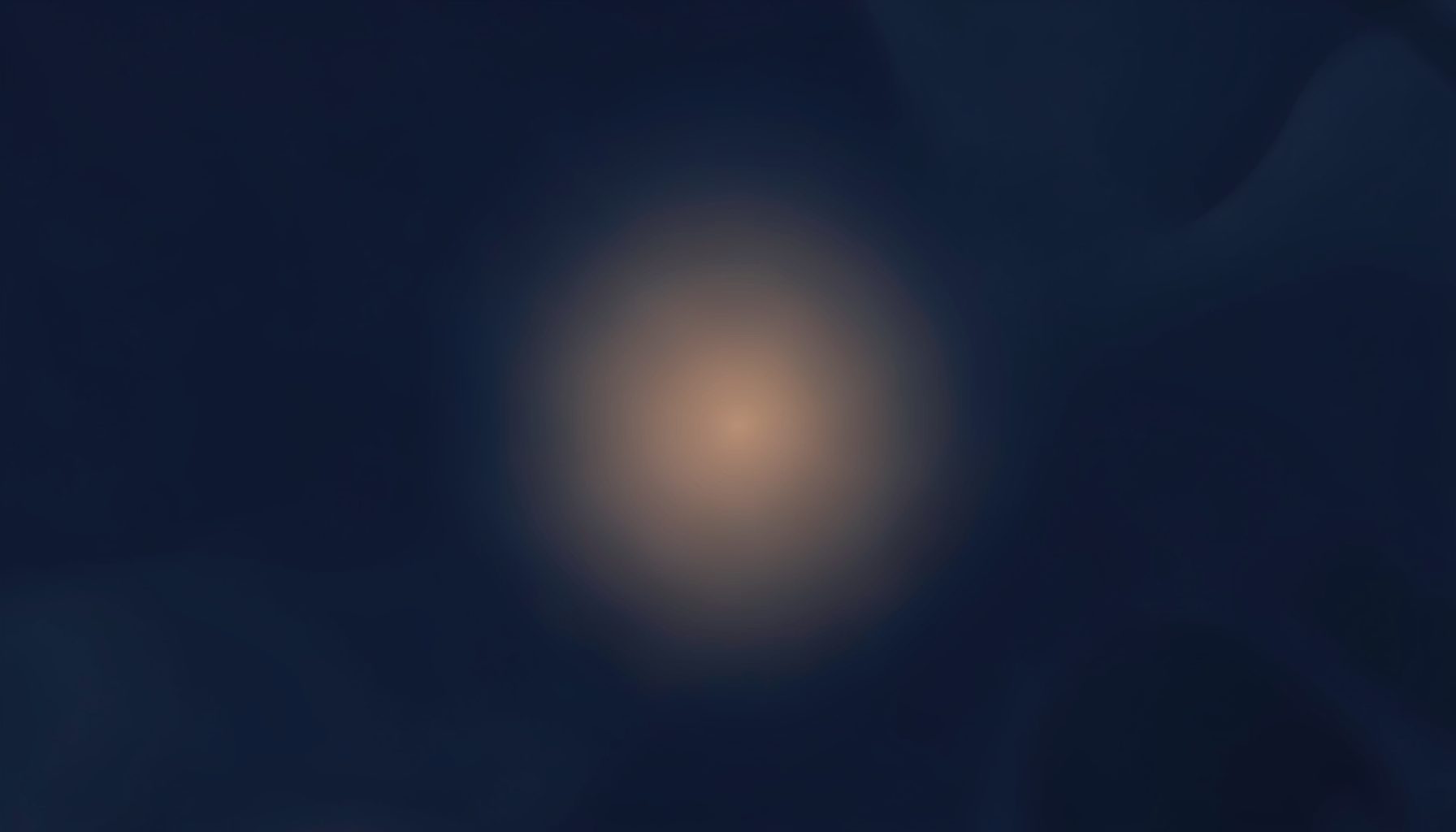 Soft abstract pattern in deep navy and muted charcoal tones, with a subtle warm glow near the center, conveying trust and calm.